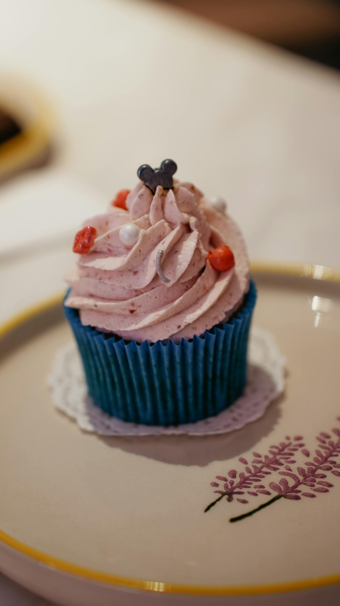 Indulge in a flavorful strawberry cupcake with pink frosting, perfect for any occasion.