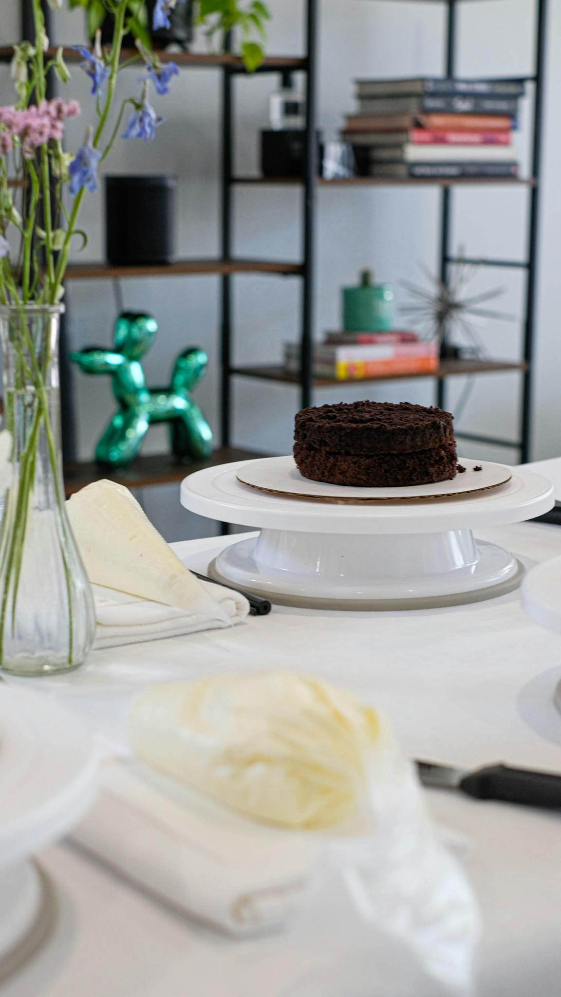 Indulge in a rich chocolate cake set on a stylish dining table with artistic decor in Chicago.